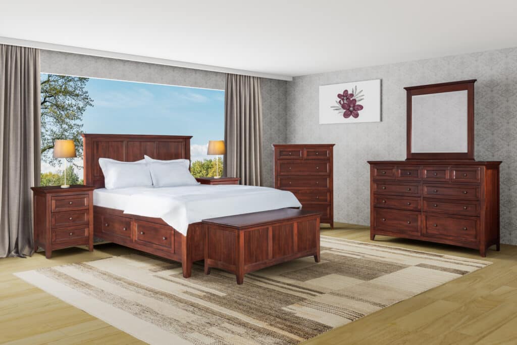 New Traditions Collection mahogany bedroom set featuring a bed, two nightstands, a tall dresser, and a dresser with a mirror in a modern bedroom with large windows and neutral decor.
